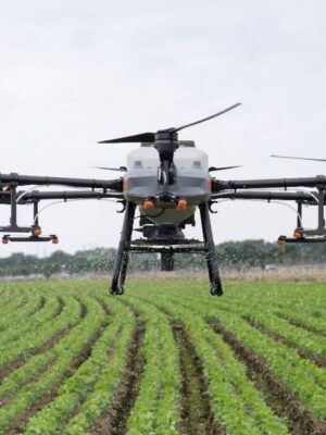 DJI Agras T30 price package including a 30-liter agricultural spraying drone unfolded over a farmland field.